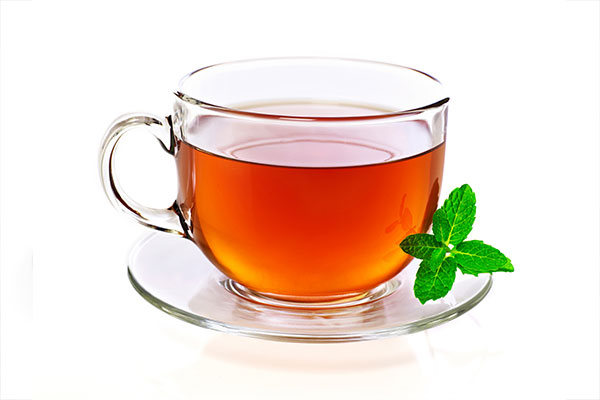 Warm tea on a saucer and a vending machine